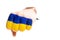 Fist with Ukraine flag broke white paper wall and torn a hole. Punch through the wall. Street fight and self defense. Concept of
