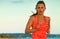 Fit active woman on beach in evening jogging