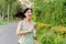 Fit Asian young woman jogging in park smiling happy running and enjoying a healthy outdoor lifestyle. Female jogger. Fitness