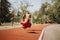 Fit, athletic man enjoys outdoor workout on sunny day. Running, sprinting, and practicing with parachute.