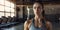 Fit Brunette In Loft Gym Wiping Sweat, Catching Breath After Intense Workout