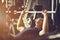 Fit caucasian handsome young man and big muscle in sportswear. Young man holding dumbbell during an exercise class in a gym.