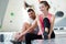 fit couple rock climbing indoors at gym