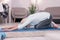 Fit elderly woman doing balasana asana at home