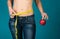 Fit female body with apple and measuring tape. Healthy fitness and eating, diet lifestyle concept.