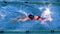 Fit female swimmer doing the butterfly stroke in swimming pool