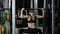 Fit girl doing exercise on smith machine
