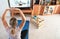 Fit girl doing pilates at home during isolation quarantine - Young woman watching fitness video tutorial while doing sport workout