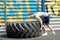 Fit girl with giant truck workout turning tire over.