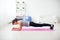 Fit girl in plank position on mat at home the living room exercise for back spine and posture Concept pilates fitness