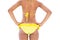 Fit girl in yellow bikini mid section rear view