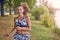 Fit healthy athletic woman jogging on a river bank