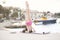 Fit healthy woman stretching on yoga mat on beach seaside,doing exercise abdominal crunches,training and lifestyle.