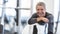 Fit in his sixties, man rests on a towel smiling inside the gym