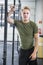 Fit Male Athlete Leaning On Metal Structure At Health Club