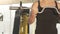 Fit male athlete lifting curl bar with strong muscular arms, bodybuilder workout