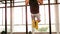 Fit man doing pull ups in fitness studio