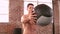 Fit man using medicine ball in gym
