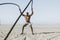 Fit man working out with battle ropes