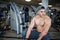 Fit and muscular arabian man doing workouts in gym