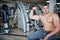 Fit and muscular arabian man posing in gym.