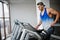 Fit and muscular arabian man posing in gym.