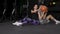 Fit and muscular couple exercising with medicine ball at gym slow motion.