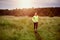 Fit muscular man jogging on a rural trail at sunset