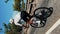 Fit muscular professional road cyclist riding bicycle uphill. Vertical video