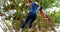 Fit people climbing a net during obstacle course 4k