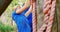 Fit people climbing a net during obstacle course 4k