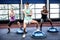 Fit people doing exercise with bosu ball