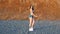 Fit slim slender sporty fitness bikini female athlete on sunset
