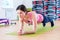 Fit sportive woman doing plank core exercise training back and press muscles concept gym sport sportsman fitness workout