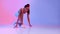 Fit Sportswoman Doing Crouch Start Ready For Running, Neon Background