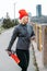 Fit sporty middle aged blonde 40s woman in red cap doing jogging workout, stretching, enjoying fitness and healthy