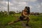 Fit and sporty runner Asian woman stretching leg and body after running workout on green field beautiful background in sport train