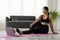 Fit sporty young asian woman online workout exercise at home. Active healthy girl enjoy sport pilates yoga fitness