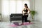 Fit sporty young asian woman online workout exercise at home. Active healthy girl enjoy sport pilates yoga fitness