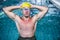 Fit swimmer holding his head with his hands