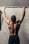 Fit toes to bar man pull-ups bars workout exercise at gym