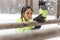 Fit woman athlete doing hamstring leg stretching exercises outdoors in woods. Female sports model exercising outdoor winter park.