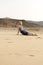 Fit Woman Doing Cobra Yoga Pose in the Outdoor Sand