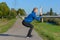 Fit woman doing crouch stretches to warm up