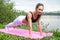 Fit woman doing full plank core exercise fitness training working out outdoors