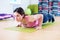 Fit woman doing plank exercise and push ups working on abdominal muscles triceps.