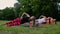 Fit woman doing plank exercise, working on abdominal midsection muscles. Fitness girl core workout in nature.