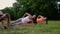 Fit woman doing plank exercise, working on abdominal midsection muscles. Fitness girl core workout in nature.
