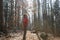 Fit woman hiker enjoying the nature, throwing leaves