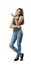 Fit woman in jeans and top standing in half-turn, head tilted to left, right arm across belly, left arm bent and raised